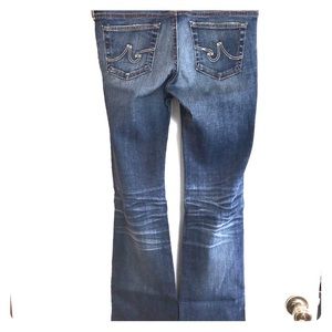 Bootcut jeans with distressed knees and whiskers
